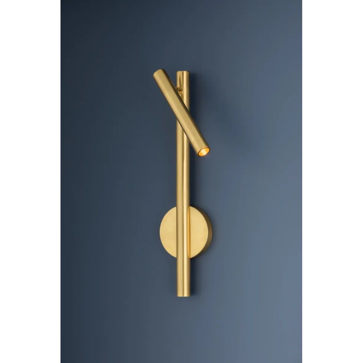 Incorporating CSL’s innovative ‘Whisper’ technology, Circleville cuts a sleek figure in Aged Brass. While it might read as industrial, the elongated tube forms lean towards modernist aesthetics. The articulating shade allows precise control to create a powerful spotlight where needed. Available as a sconce and floor lamp. Amethyst Home provides interior design, new home construction design consulting, vintage area rugs, and lighting in the Des Moines metro area.