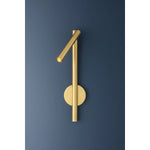 Incorporating CSL’s innovative ‘Whisper’ technology, Circleville cuts a sleek figure in Aged Brass. While it might read as industrial, the elongated tube forms lean towards modernist aesthetics. The articulating shade allows precise control to create a powerful spotlight where needed. Available as a sconce and floor lamp. Amethyst Home provides interior design, new home construction design consulting, vintage area rugs, and lighting in the Houston metro area.