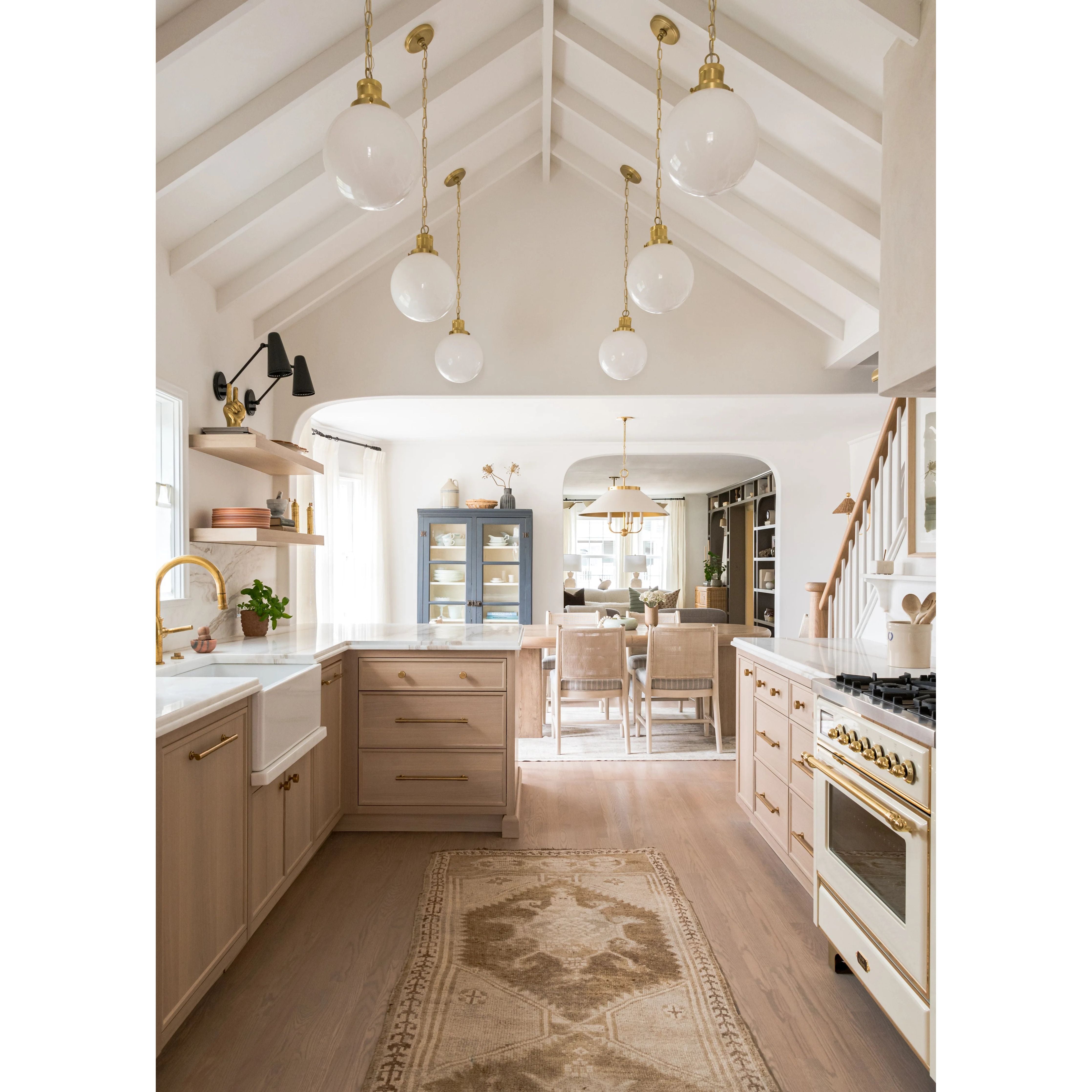 This classic metal shade design feels special with fresh finish combinations and sleek, heritage-inspired details. The contrastiing Aged Brass accents and modern gooseneck arm allow the pendants and sconce an updated, yet classic feel. The tapered shade over a five-light candelabra give the chandelier new traditional appeal. Amethyst Home provides interior design, new home construction design consulting, vintage area rugs, and lighting in the Austin metro area.