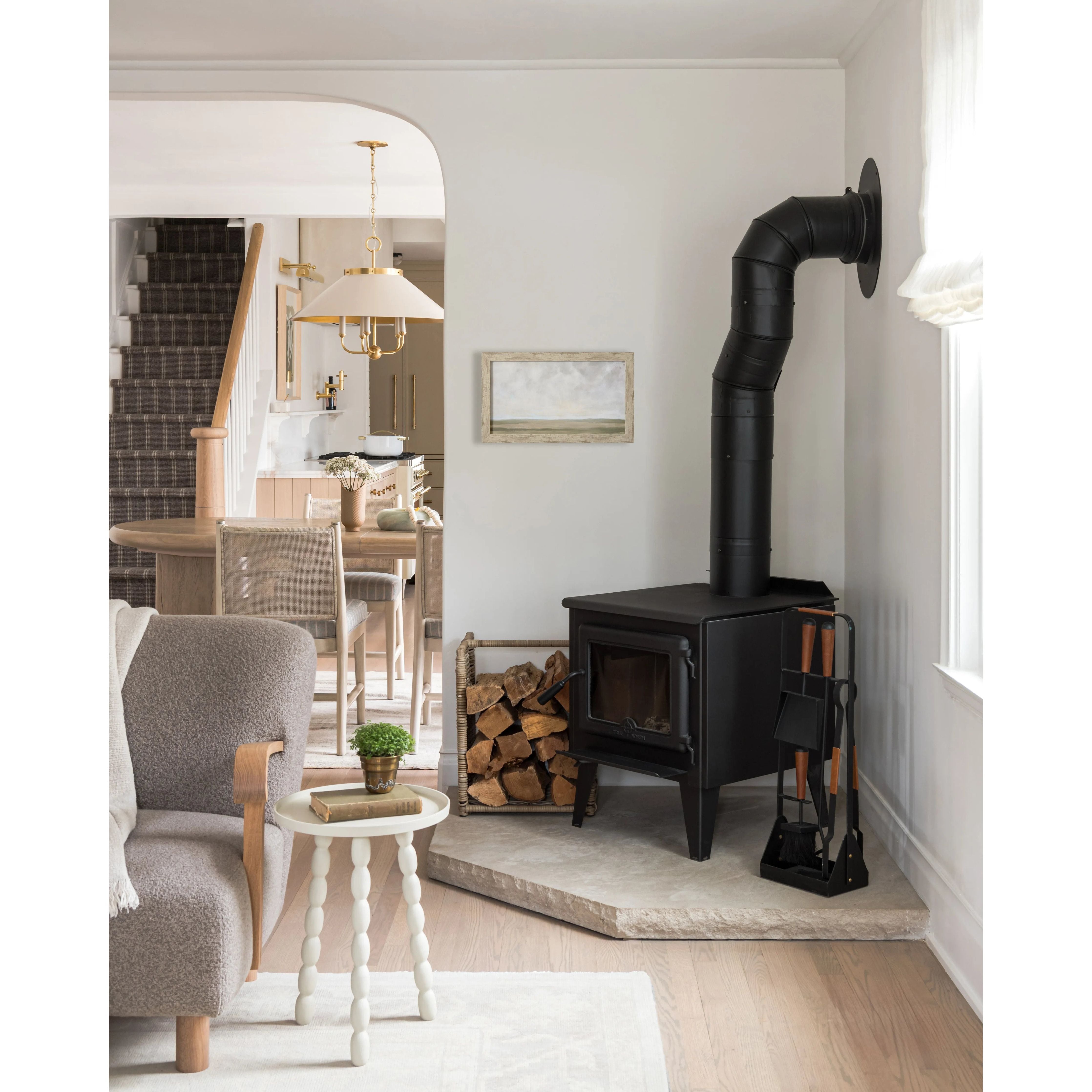 This classic metal shade design feels special with fresh finish combinations and sleek, heritage-inspired details. The contrastiing Aged Brass accents and modern gooseneck arm allow the pendants and sconce an updated, yet classic feel. The tapered shade over a five-light candelabra give the chandelier new traditional appeal. Amethyst Home provides interior design, new home construction design consulting, vintage area rugs, and lighting in the Houston metro area.