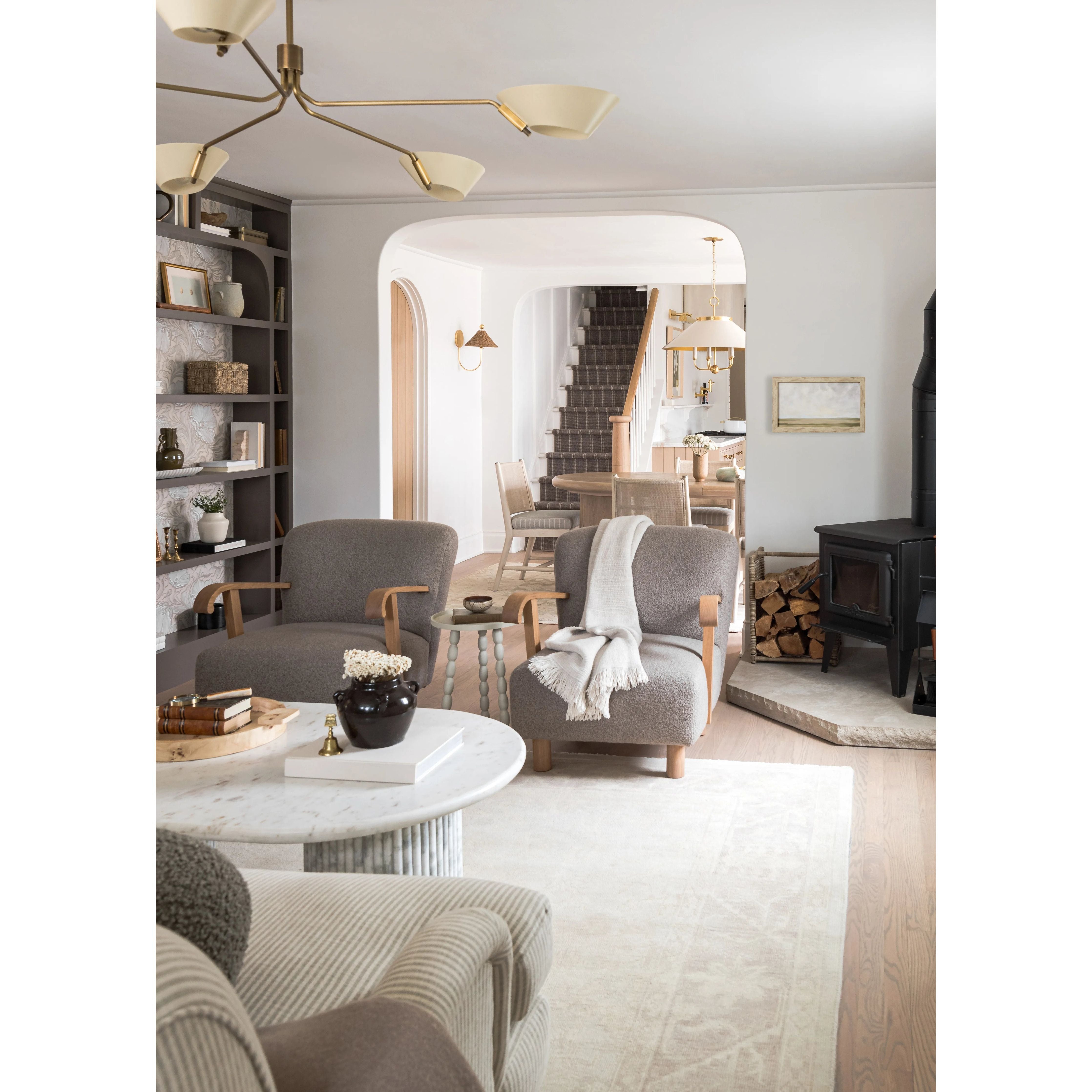 This classic metal shade design feels special with fresh finish combinations and sleek, heritage-inspired details. The contrastiing Aged Brass accents and modern gooseneck arm allow the pendants and sconce an updated, yet classic feel. The tapered shade over a five-light candelabra give the chandelier new traditional appeal. Amethyst Home provides interior design, new home construction design consulting, vintage area rugs, and lighting in the Kansas City metro area.