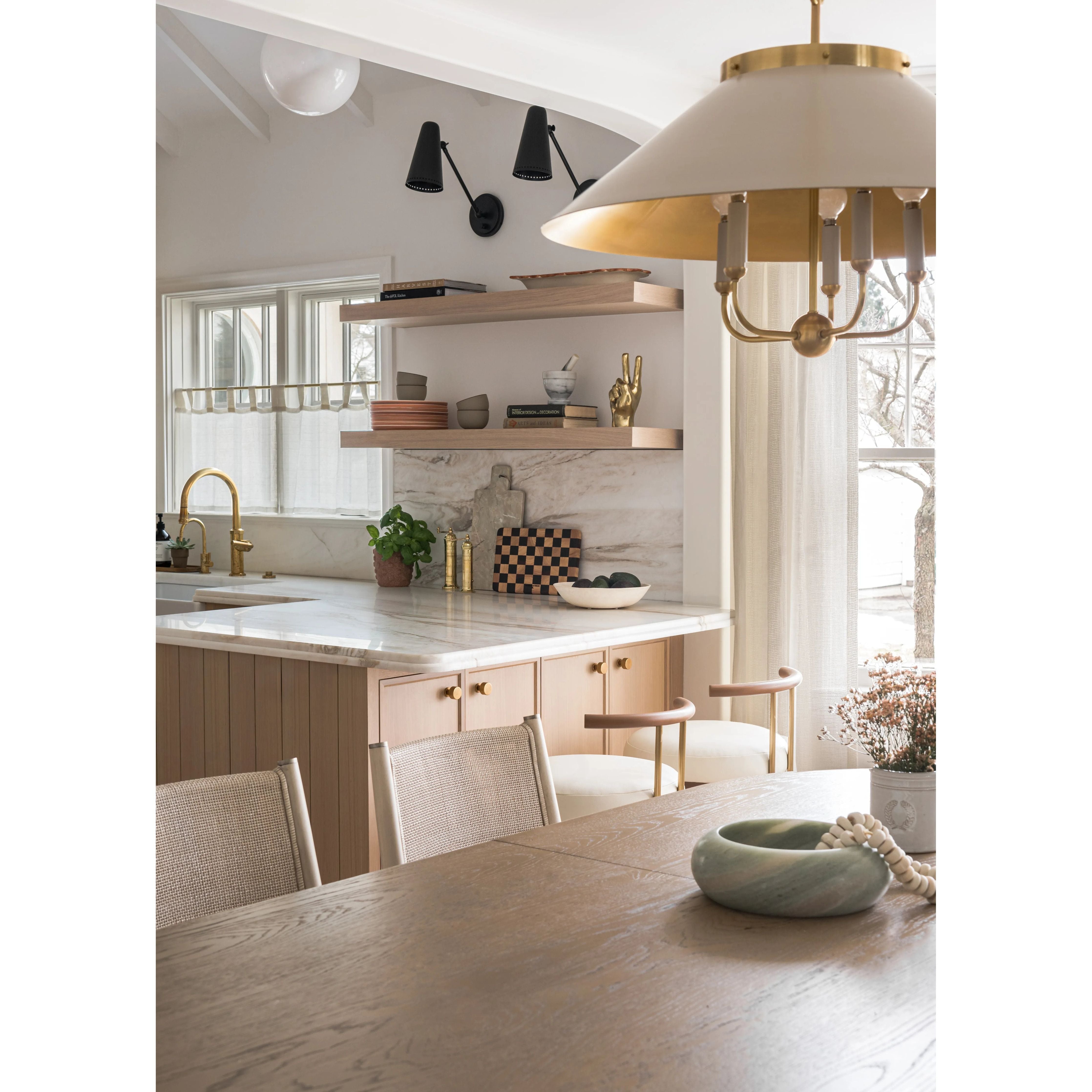 This classic metal shade design feels special with fresh finish combinations and sleek, heritage-inspired details. The contrastiing Aged Brass accents and modern gooseneck arm allow the pendants and sconce an updated, yet classic feel. The tapered shade over a five-light candelabra give the chandelier new traditional appeal. Amethyst Home provides interior design, new home construction design consulting, vintage area rugs, and lighting in the Laguna Beach metro area.