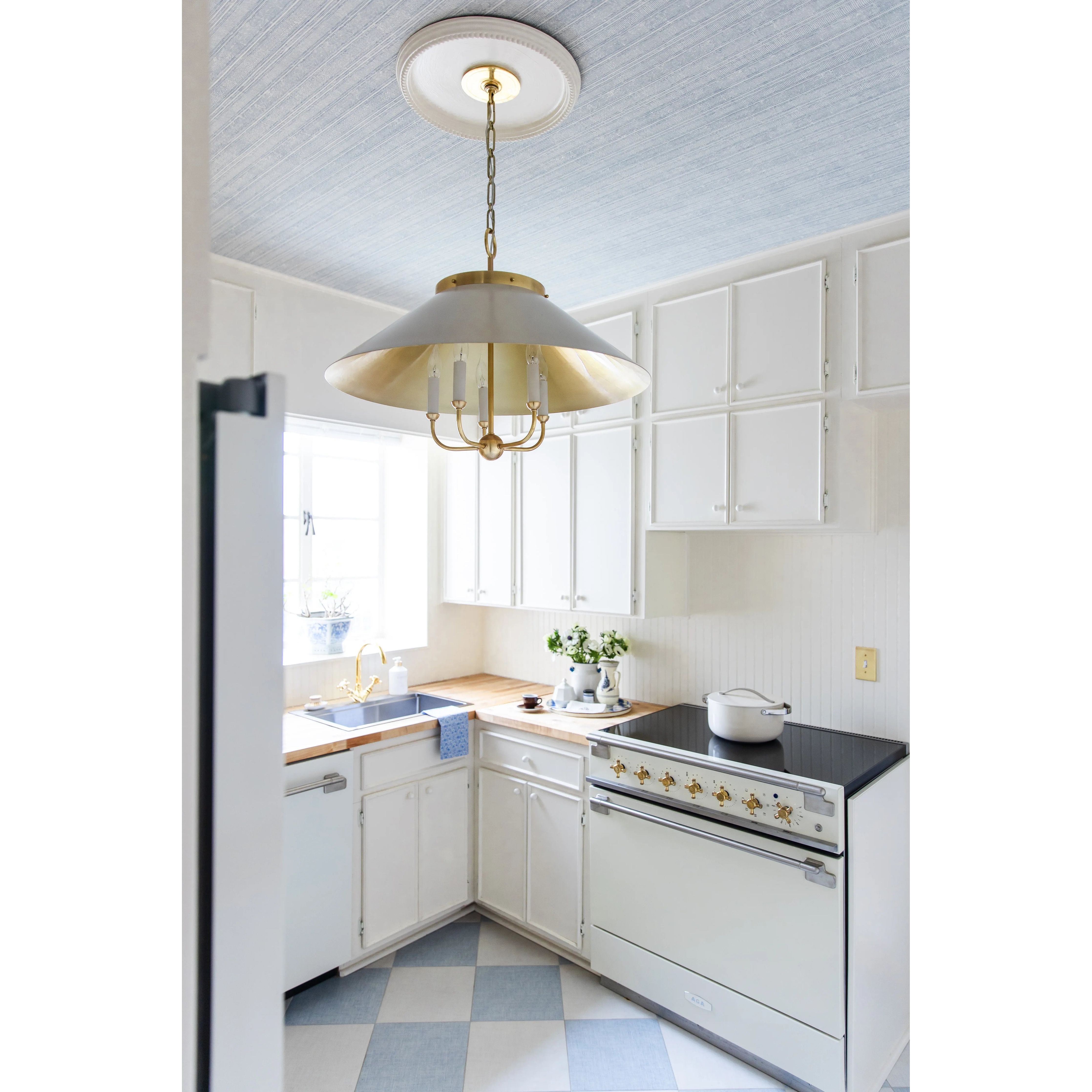 This classic metal shade design feels special with fresh finish combinations and sleek, heritage-inspired details. The contrastiing Aged Brass accents and modern gooseneck arm allow the pendants and sconce an updated, yet classic feel. The tapered shade over a five-light candelabra give the chandelier new traditional appeal. Amethyst Home provides interior design, new home construction design consulting, vintage area rugs, and lighting in the Portland metro area.