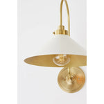 This classic metal shade design feels special with fresh finish combinations and sleek, heritage-inspired details. The contrastiing Aged Brass accents and modern gooseneck arm allow the pendants and sconce an updated, yet classic feel. The tapered shade over a five-light candelabra give the chandelier new traditional appeal. Amethyst Home provides interior design, new home construction design consulting, vintage area rugs, and lighting in the Los Angeles metro area.