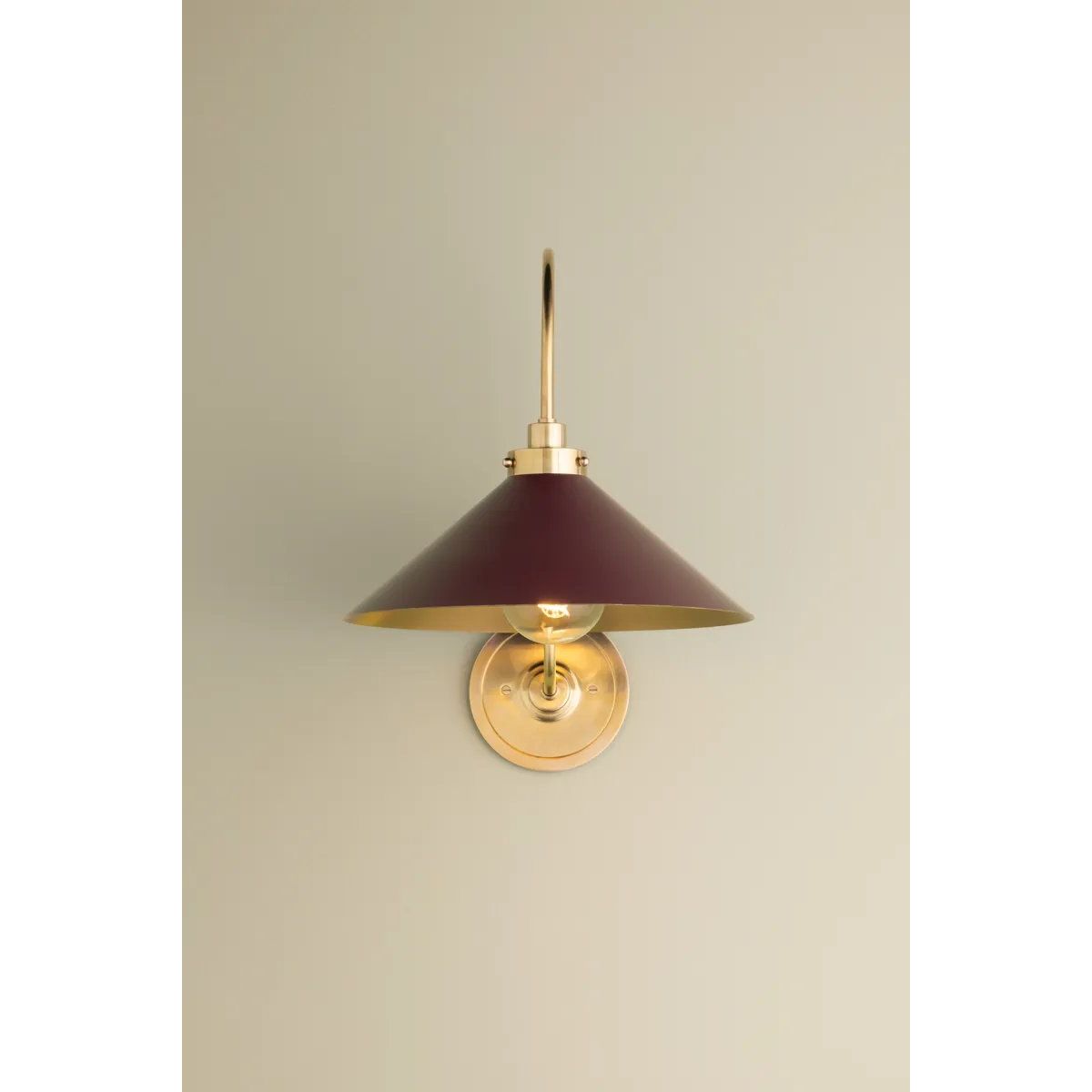 What began as a chandelier is now an entire family of Clivedon fixtures. Featuring sharp tapered shades and heritage-inspired details, these are the new elevated basics for the modern home. With Aged Brass and either Soft Studio Green or Soft Crimson finish options, each shade is metal on the inside and painted on the outside. Amethyst Home provides interior design, new home construction design consulting, vintage area rugs, and lighting in the Nashville metro area.