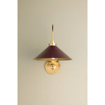 What began as a chandelier is now an entire family of Clivedon fixtures. Featuring sharp tapered shades and heritage-inspired details, these are the new elevated basics for the modern home. With Aged Brass and either Soft Studio Green or Soft Crimson finish options, each shade is metal on the inside and painted on the outside. Amethyst Home provides interior design, new home construction design consulting, vintage area rugs, and lighting in the Nashville metro area.