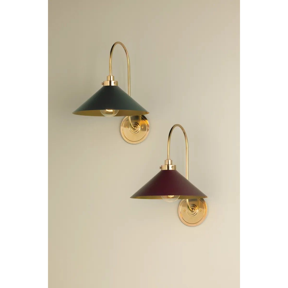 What began as a chandelier is now an entire family of Clivedon fixtures. Featuring sharp tapered shades and heritage-inspired details, these are the new elevated basics for the modern home. With Aged Brass and either Soft Studio Green or Soft Crimson finish options, each shade is metal on the inside and painted on the outside. Amethyst Home provides interior design, new home construction design consulting, vintage area rugs, and lighting in the Boston metro area.