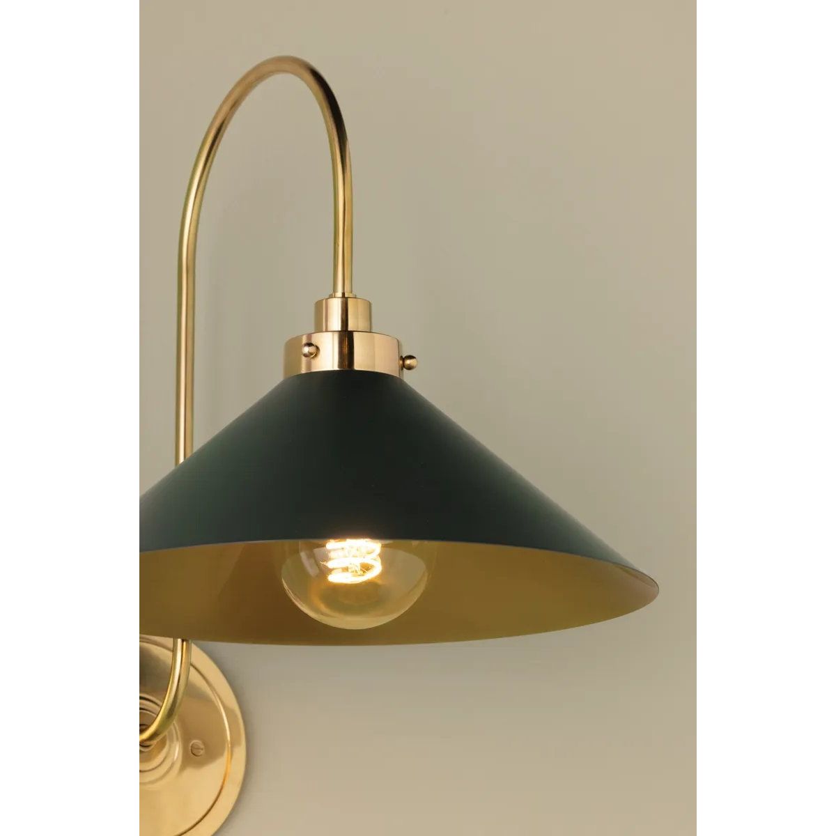 What began as a chandelier is now an entire family of Clivedon fixtures. Featuring sharp tapered shades and heritage-inspired details, these are the new elevated basics for the modern home. With Aged Brass and either Soft Studio Green or Soft Crimson finish options, each shade is metal on the inside and painted on the outside. Amethyst Home provides interior design, new home construction design consulting, vintage area rugs, and lighting in the Omaha metro area.