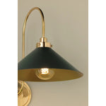 What began as a chandelier is now an entire family of Clivedon fixtures. Featuring sharp tapered shades and heritage-inspired details, these are the new elevated basics for the modern home. With Aged Brass and either Soft Studio Green or Soft Crimson finish options, each shade is metal on the inside and painted on the outside. Amethyst Home provides interior design, new home construction design consulting, vintage area rugs, and lighting in the Omaha metro area.