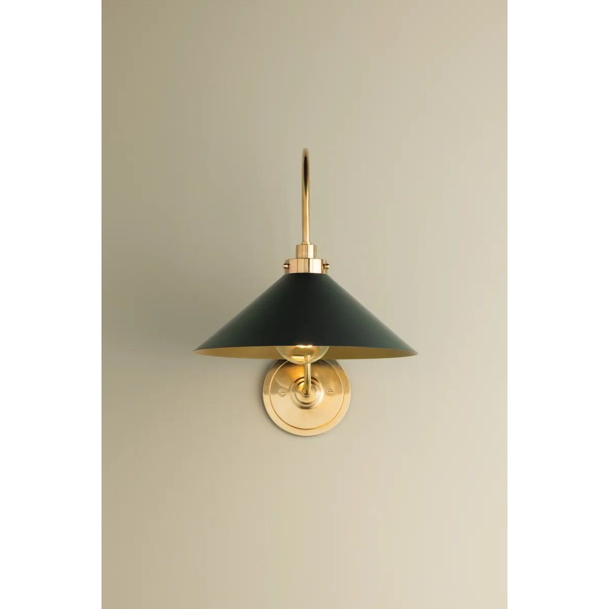 What began as a chandelier is now an entire family of Clivedon fixtures. Featuring sharp tapered shades and heritage-inspired details, these are the new elevated basics for the modern home. With Aged Brass and either Soft Studio Green or Soft Crimson finish options, each shade is metal on the inside and painted on the outside. Amethyst Home provides interior design, new home construction design consulting, vintage area rugs, and lighting in the Winter Garden metro area.