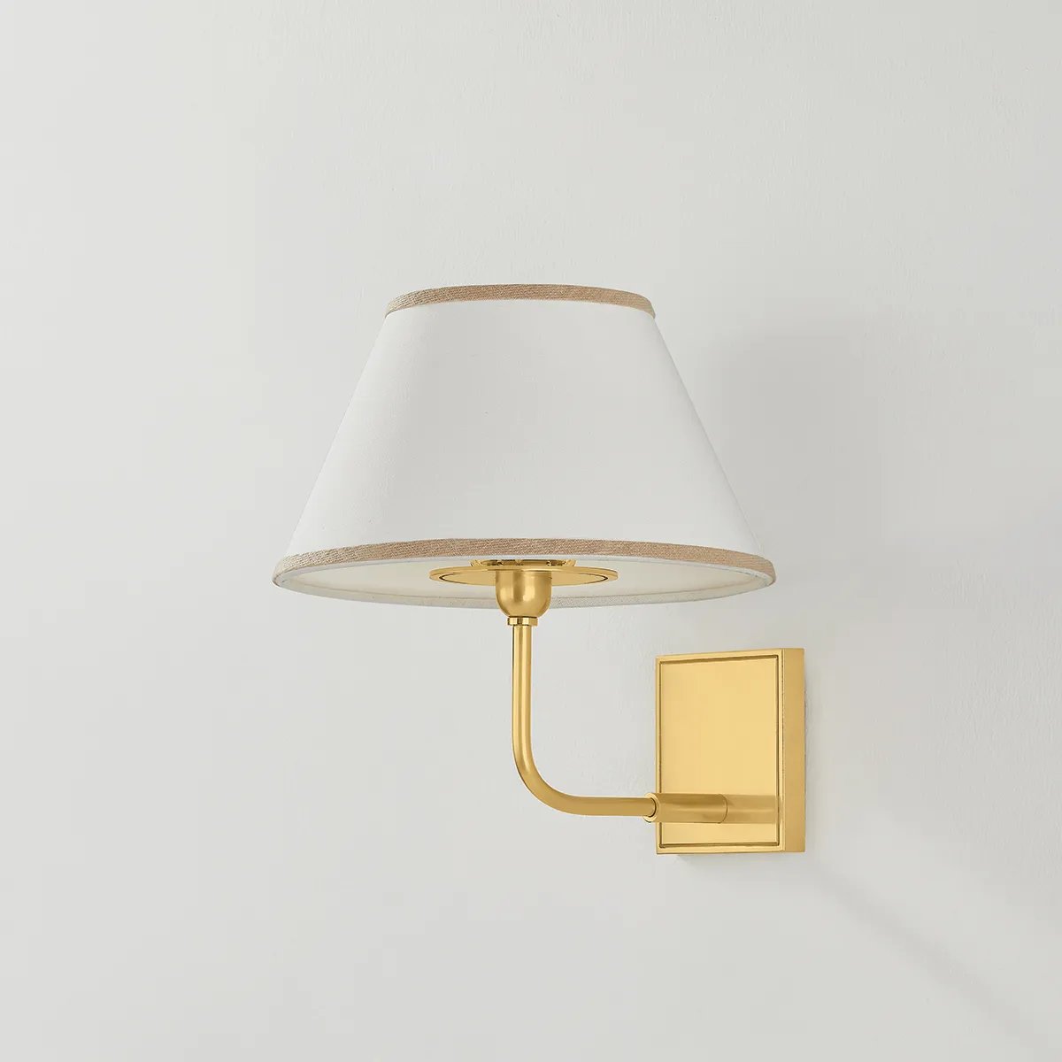 A vintage-inspired silhouette is elevated through thoughtful details in this transitional family. Arranged at varying heights, the overscale white linen tapered shades create a voluminous effect, like a sail billowing in the wind. Ivory trim provides subtle visual interest while remaining fresh and neutral. Amethyst Home provides interior design, new home construction design consulting, vintage area rugs, and lighting in the Los Angeles metro area.