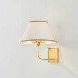 A vintage-inspired silhouette is elevated through thoughtful details in this transitional family. Arranged at varying heights, the overscale white linen tapered shades create a voluminous effect, like a sail billowing in the wind. Ivory trim provides subtle visual interest while remaining fresh and neutral. Amethyst Home provides interior design, new home construction design consulting, vintage area rugs, and lighting in the Seattle metro area.