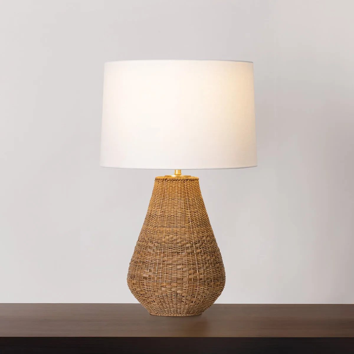 Inspired by vintage handwoven baskets, Eastbridge is defined by warm textural contrasts and tonal variations. Handwoven from natural abaca, the voluminous base is embellished with a simple striped pattern. Amethyst Home provides interior design, new home construction design consulting, vintage area rugs, and lighting in the Miami metro area.