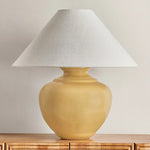 Add a punch of color to your space with the French Ridge table lamp. This ceramic beauty is glazed in a Dijon hue that brings pure sunshine inside. The rounded base is balanced by a sharply tapered conical shade and accented with Aged Brass hardware. It’s a dose of design dopamine for a cozy corner or console Amethyst Home provides interior design, new home construction design consulting, vintage area rugs, and lighting in the Houston metro area.