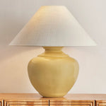 Add a punch of color to your space with the French Ridge table lamp. This ceramic beauty is glazed in a Dijon hue that brings pure sunshine inside. The rounded base is balanced by a sharply tapered conical shade and accented with Aged Brass hardware. It’s a dose of design dopamine for a cozy corner or console Amethyst Home provides interior design, new home construction design consulting, vintage area rugs, and lighting in the Scottsdale metro area.