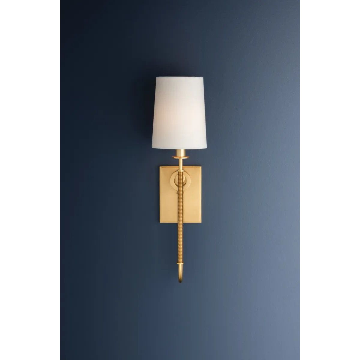 The antique-inspired silhouette of the Glenmont sconce is slender and refined with machine-led hardware. Each stem features a horizontal knurl resembling a screw, adding texture and a contemporary feel to the fixture. Amethyst Home provides interior design, new home construction design consulting, vintage area rugs, and lighting in the Laguna Beach metro area.