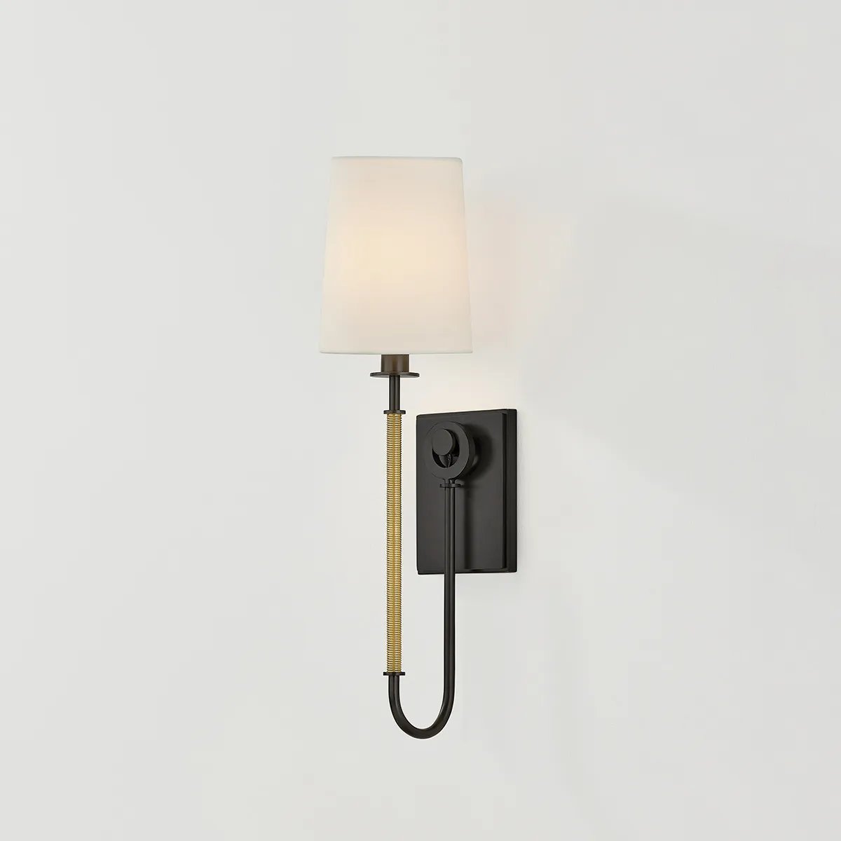 The antique-inspired silhouette of the Glenmont sconce is slender and refined with machine-led hardware. Each stem features a horizontal knurl resembling a screw, adding texture and a contemporary feel to the fixture. Amethyst Home provides interior design, new home construction design consulting, vintage area rugs, and lighting in the Calabasas metro area.