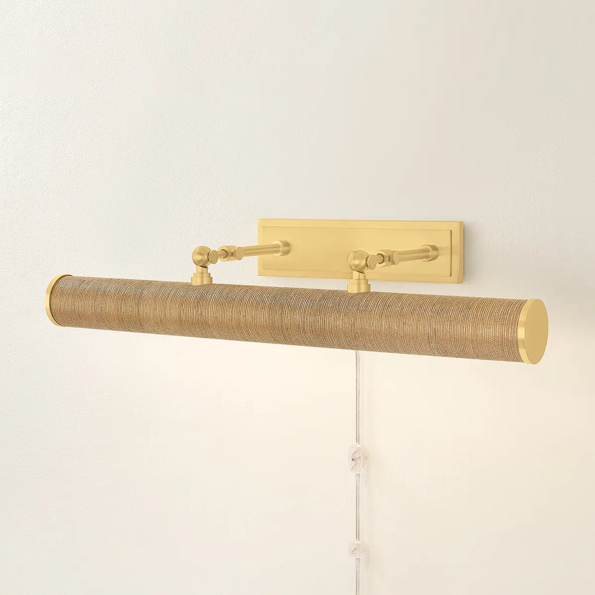 Whether you want to bring more attention to artwork or highlight a wall shelf of your favorite things, Holly is up to the task. This plug-in picture light now comes in an Aged Brass or Natural Grasscloth finish to create a more traditional or distinctive look. Amethyst Home provides interior design, new home construction design consulting, vintage area rugs, and lighting in the Winter Garden metro area.