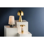 The contrast between the oblong domed shade and the conical base of Hopkinton creates a striking geometric design. Whether this petite lamp is finished in Aged Brass or Distressed Bronze, the on-trend mushroom silhouette adds a dose of personality. Its integrated rechargeable LED light source ensures lasting functionality.  Amethyst Home provides interior design, new home construction design consulting, vintage area rugs, and lighting in the Washington metro area.