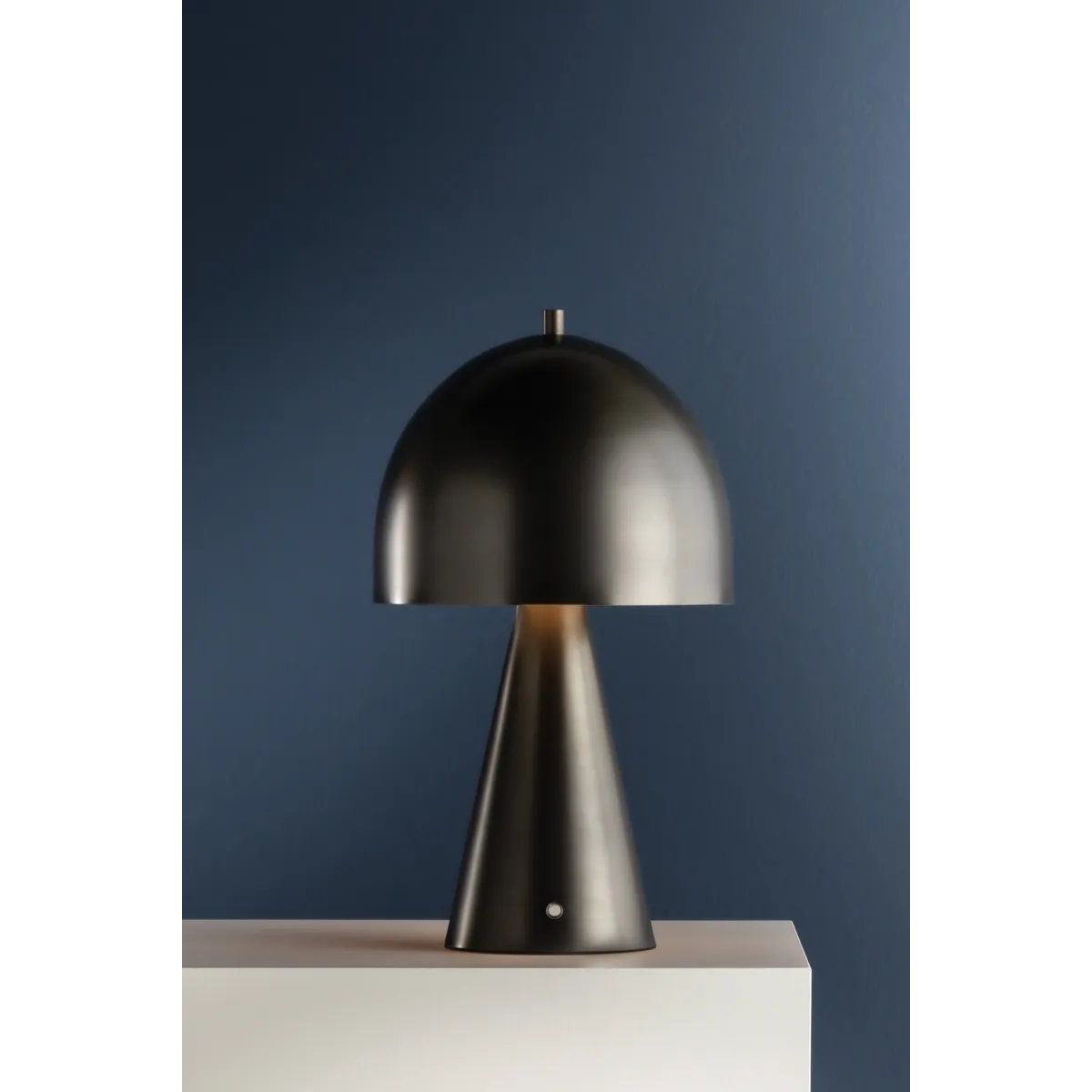 The contrast between the oblong domed shade and the conical base of Hopkinton creates a striking geometric design. Whether this petite lamp is finished in Aged Brass or Distressed Bronze, the on-trend mushroom silhouette adds a dose of personality. Its integrated rechargeable LED light source ensures lasting functionality.  Amethyst Home provides interior design, new home construction design consulting, vintage area rugs, and lighting in the Washington metro area.