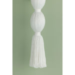 A celebration of authentic handicraft, the cinched silhouette of Indra resembles an elongated tassel. The cotton string and white linen shade create an all-over light, fresh appearance, accented by Aged Brass hardware at the neck. This single-light sconce serves as an artistic piece for small spaces in need of a spruce. Amethyst Home provides interior design, new home construction design consulting, vintage area rugs, and lighting in the San Diego metro area.