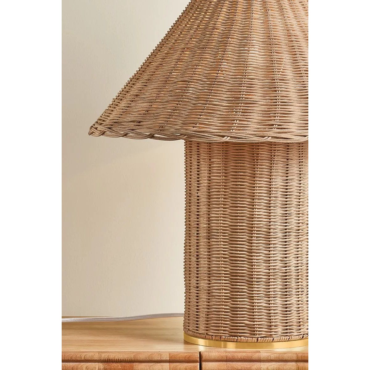 Woven from natural wicker, the Jeanette table lamp channels the inviting spirit of cottagecore with a bold, sculptural silhouette. A textural shade rests on a matching body, with a rim of decorative Aged Brass glimmering at the base. Perfect for a console, end table, or bedside, Jeanette infuses any space with a dose of charm Amethyst Home provides interior design, new home construction design consulting, vintage area rugs, and lighting in the Alpharetta metro area.
