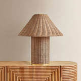 Woven from natural wicker, the Jeanette table lamp channels the inviting spirit of cottagecore with a bold, sculptural silhouette. A textural shade rests on a matching body, with a rim of decorative Aged Brass glimmering at the base. Perfect for a console, end table, or bedside, Jeanette infuses any space with a dose of charm Amethyst Home provides interior design, new home construction design consulting, vintage area rugs, and lighting in the Newport Beach metro area.