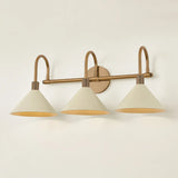 A modern interpretation of Art Deco shapes, the Jovani bath bar features elongated arms and sharply tapered Soft Sand shades. The clean design highlights the connections between elements through pronounced fittings and subtle fluting details. Finished in classic Patina Brass, Jovani is available with 1, 2, or 3 lights. Amethyst Home provides interior design, new home construction design consulting, vintage area rugs, and lighting in the Omaha metro area.