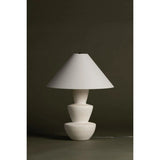 A series of three stacked, bowl-like shapes in ivory texture ceramic give this table lamp an organic, hand-crafted silhouette. The tapered off-white linen shade and Patina Brass accents add to the warm, natural beauty. Amethyst Home provides interior design, new home construction design consulting, vintage area rugs, and lighting in the Des Moines metro area.