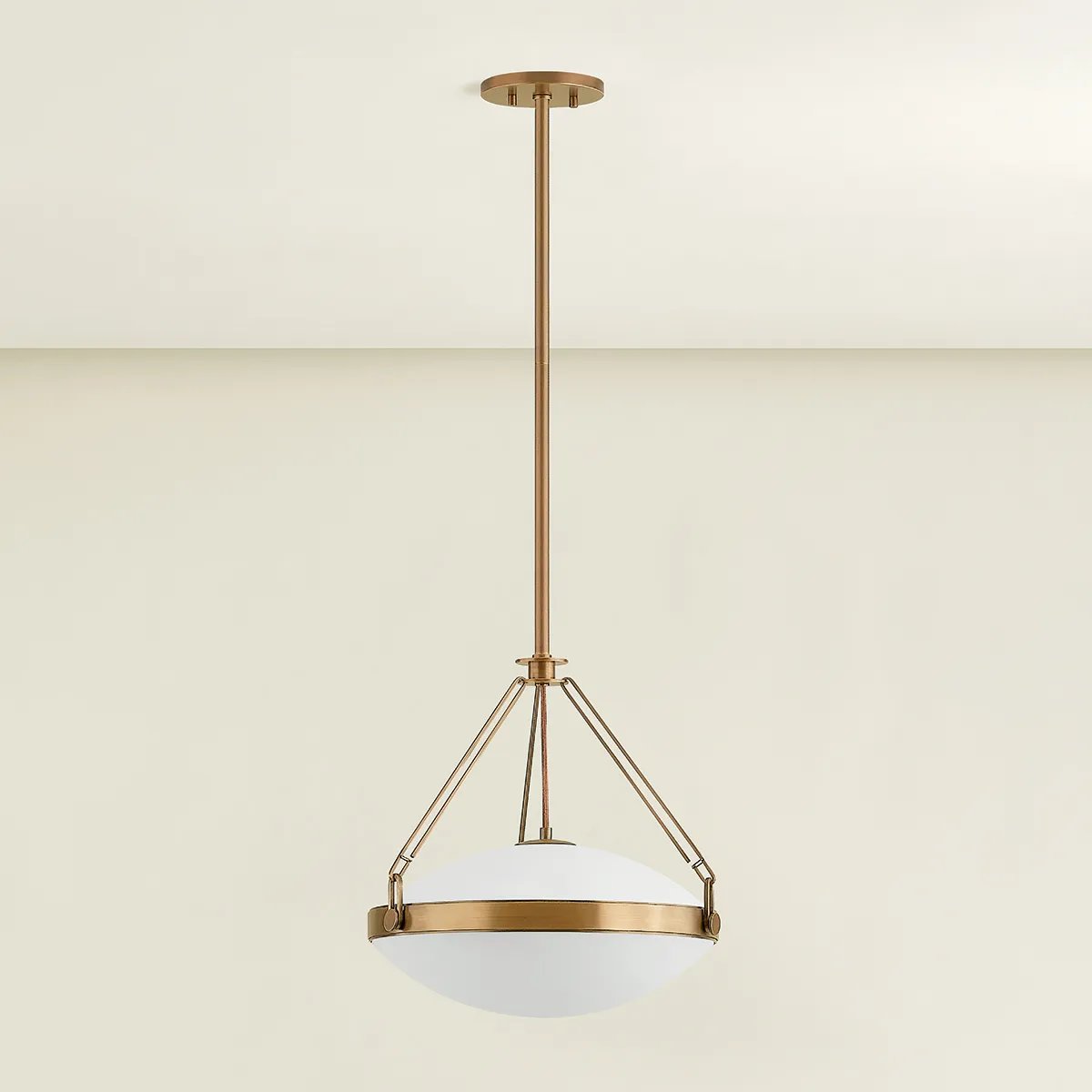 The Kade pendant updates a nostalgic shape with sleek, industrial metalwork and two large opal matte glass shades. Inspired by vintage elements, it features a striking suspension technique with three oversized loops connecting to the central housing above the fixture. The Patina Brass finish adds old-world finesse to the frame. Amethyst Home provides interior design, new home construction design consulting, vintage area rugs, and lighting in the Laguna Beach metro area.