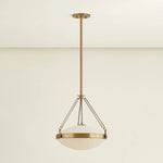 The Kade pendant updates a nostalgic shape with sleek, industrial metalwork and two large opal matte glass shades. Inspired by vintage elements, it features a striking suspension technique with three oversized loops connecting to the central housing above the fixture. The Patina Brass finish adds old-world finesse to the frame. Amethyst Home provides interior design, new home construction design consulting, vintage area rugs, and lighting in the Winter Garden metro area.