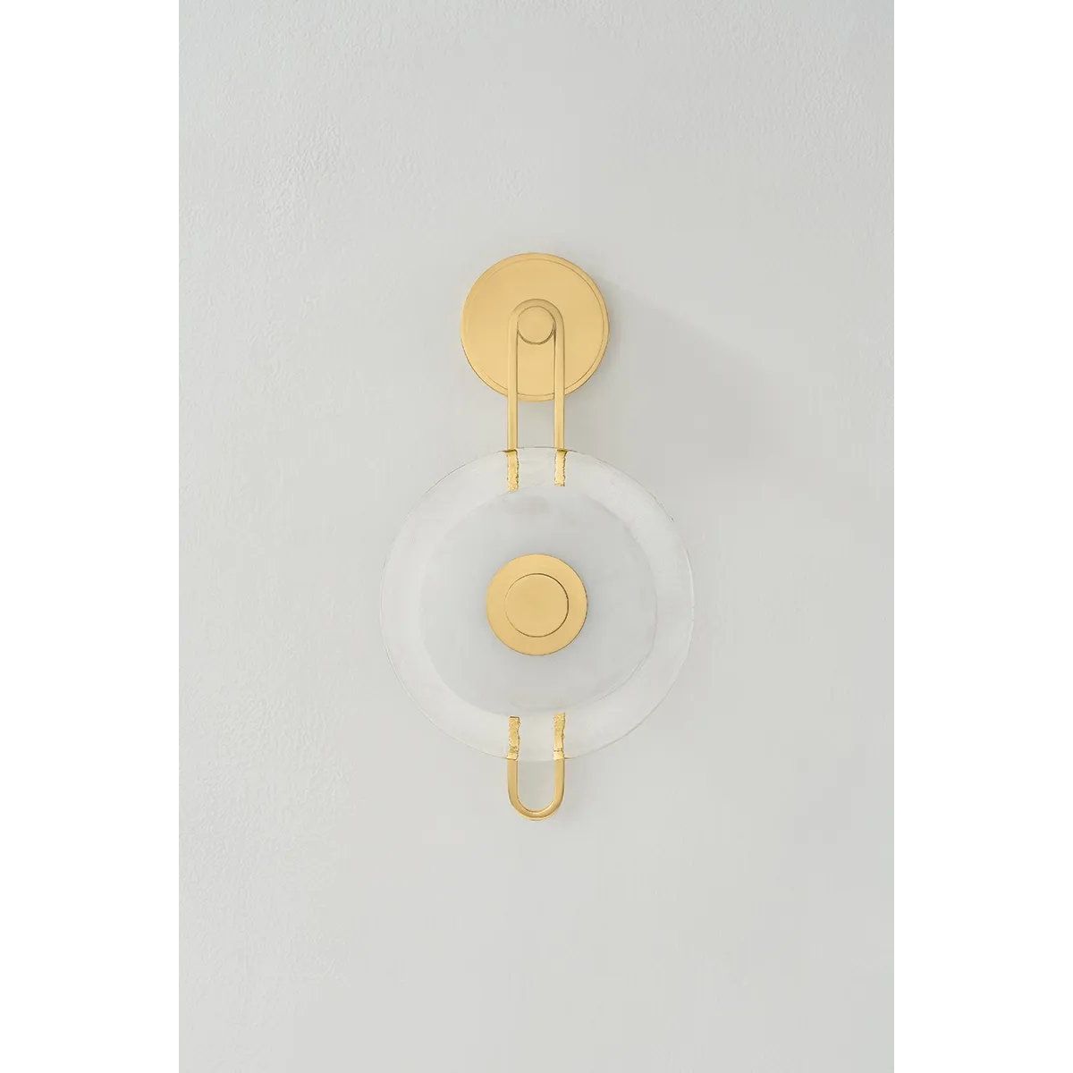 The earring-like design of Keuka Park exudes ornamental, graphic appeal. A thick disc of Blonchino Piastre glass is illuminated at the point where it attaches to the racetrack frame of this striking wall fixture. Whether finished in Aged Brass or Old Bronze, Keuka Park brings modernist artistry to any wall.  Amethyst Home provides interior design, new home construction design consulting, vintage area rugs, and lighting in the Monterey metro area.