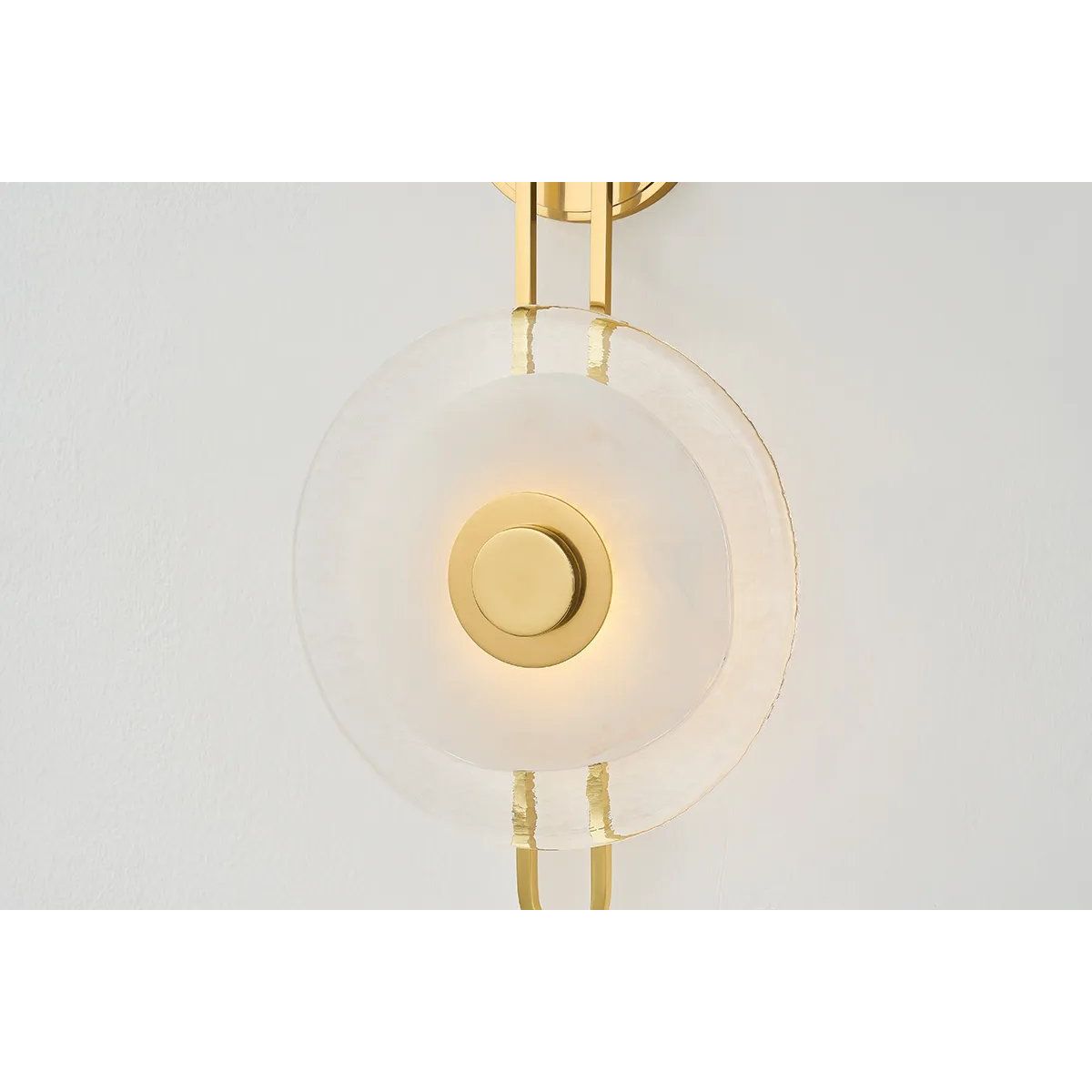 The earring-like design of Keuka Park exudes ornamental, graphic appeal. A thick disc of Blonchino Piastre glass is illuminated at the point where it attaches to the racetrack frame of this striking wall fixture. Whether finished in Aged Brass or Old Bronze, Keuka Park brings modernist artistry to any wall.  Amethyst Home provides interior design, new home construction design consulting, vintage area rugs, and lighting in the Winter Garden metro area.