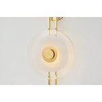 The earring-like design of Keuka Park exudes ornamental, graphic appeal. A thick disc of Blonchino Piastre glass is illuminated at the point where it attaches to the racetrack frame of this striking wall fixture. Whether finished in Aged Brass or Old Bronze, Keuka Park brings modernist artistry to any wall.  Amethyst Home provides interior design, new home construction design consulting, vintage area rugs, and lighting in the Winter Garden metro area.