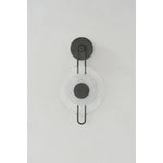 The earring-like design of Keuka Park exudes ornamental, graphic appeal. A thick disc of Blonchino Piastre glass is illuminated at the point where it attaches to the racetrack frame of this striking wall fixture. Whether finished in Aged Brass or Old Bronze, Keuka Park brings modernist artistry to any wall.  Amethyst Home provides interior design, new home construction design consulting, vintage area rugs, and lighting in the Miami metro area.