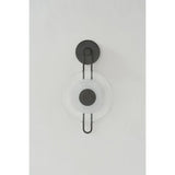 The earring-like design of Keuka Park exudes ornamental, graphic appeal. A thick disc of Blonchino Piastre glass is illuminated at the point where it attaches to the racetrack frame of this striking wall fixture. Whether finished in Aged Brass or Old Bronze, Keuka Park brings modernist artistry to any wall.  Amethyst Home provides interior design, new home construction design consulting, vintage area rugs, and lighting in the Miami metro area.