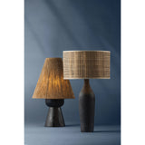 A unique approach to shading, clever play on proportions, and intriguing use of textures make the Mannsville table lamp a worthy conversation piece. Carved from Black Pine Wood, the tapered base gives the lamp a rich, organic aesthetic. Amethyst Home provides interior design, new home construction design consulting, vintage area rugs, and lighting in the Boston metro area.