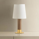 The Meadowbrook rechargeable lamp reinterprets a traditional silhouette with charming details. A beautifully grained light oak base rests upon a scalloped Aged Brass foot, introducing a graphic floral element. Topped with a classic white linen shade, the design balances decorative appeal with modern tailoring. Amethyst Home provides interior design, new home construction design consulting, vintage area rugs, and lighting in the Des Moines metro area.