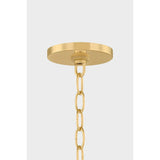 Inspired by the softly layered petals of a coneflower, this whimsical pendant blooms in mid-air to create an airy centerpiece. The natural linen shades of Nadine curl into a staggered, domed array that conceals the inner light source. Elegantly suspended from a refined Aged Brass rod and chain, Nadine is a botanic delight for the modern home.  Amethyst Home provides interior design, new home construction design consulting, vintage area rugs, and lighting in the Scottsdale metro area.