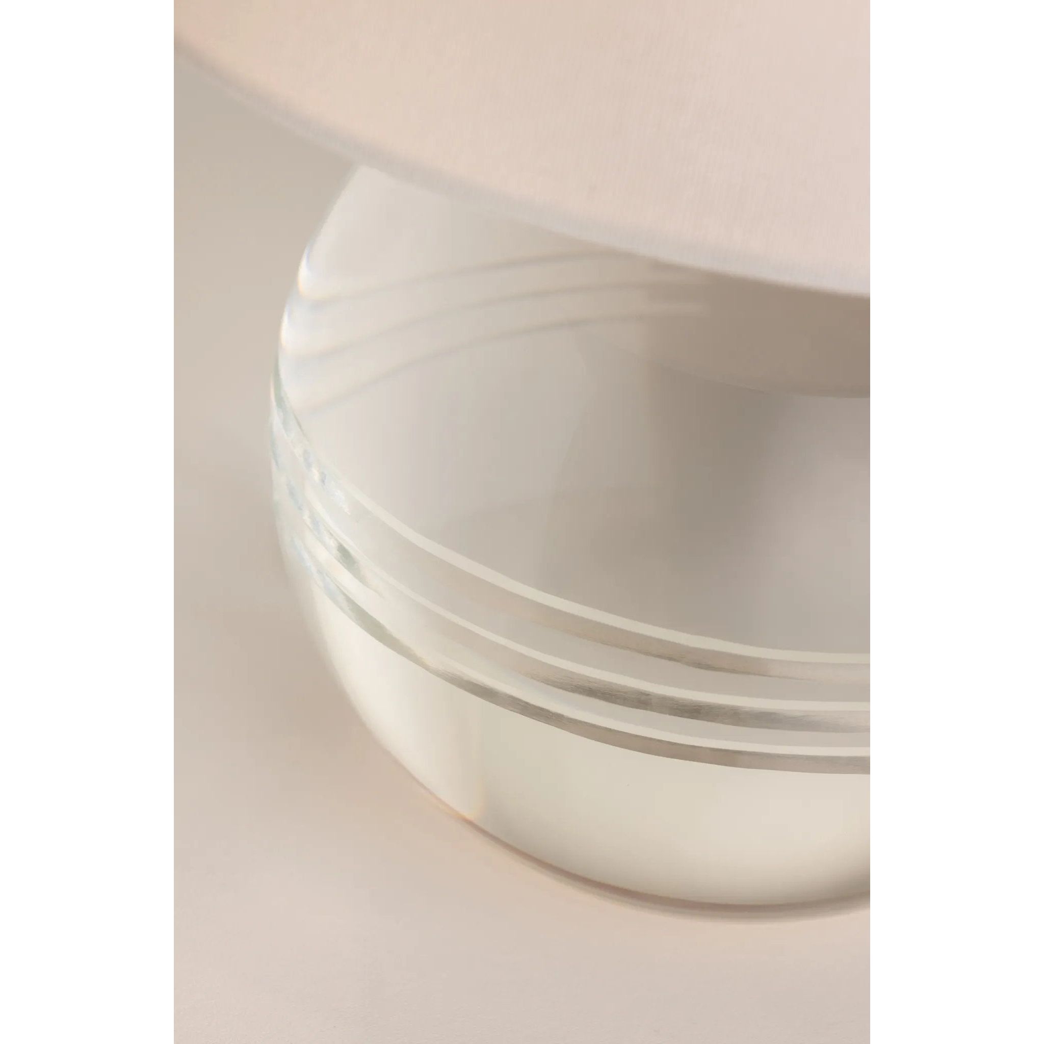 Ridged with ripple-like cuts, the crystal base of the Nicole table lamp makes for an eye-catching accent piece. Topped with a beautiful white linen shade, this pretty portable is rechargeable, adding convenience when styling. With classic Aged Brass-finished hardware, it’s the perfect addition to any bookshelf or small space. Amethyst Home provides interior design, new home construction design consulting, vintage area rugs, and lighting in the Newport Beach metro area.