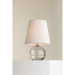 Ridged with ripple-like cuts, the crystal base of the Nicole table lamp makes for an eye-catching accent piece. Topped with a beautiful white linen shade, this pretty portable is rechargeable, adding convenience when styling. With classic Aged Brass-finished hardware, it’s the perfect addition to any bookshelf or small space. Amethyst Home provides interior design, new home construction design consulting, vintage area rugs, and lighting in the Tampa metro area.