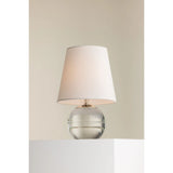 Ridged with ripple-like cuts, the crystal base of the Nicole table lamp makes for an eye-catching accent piece. Topped with a beautiful white linen shade, this pretty portable is rechargeable, adding convenience when styling. With classic Aged Brass-finished hardware, it’s the perfect addition to any bookshelf or small space. Amethyst Home provides interior design, new home construction design consulting, vintage area rugs, and lighting in the Tampa metro area.