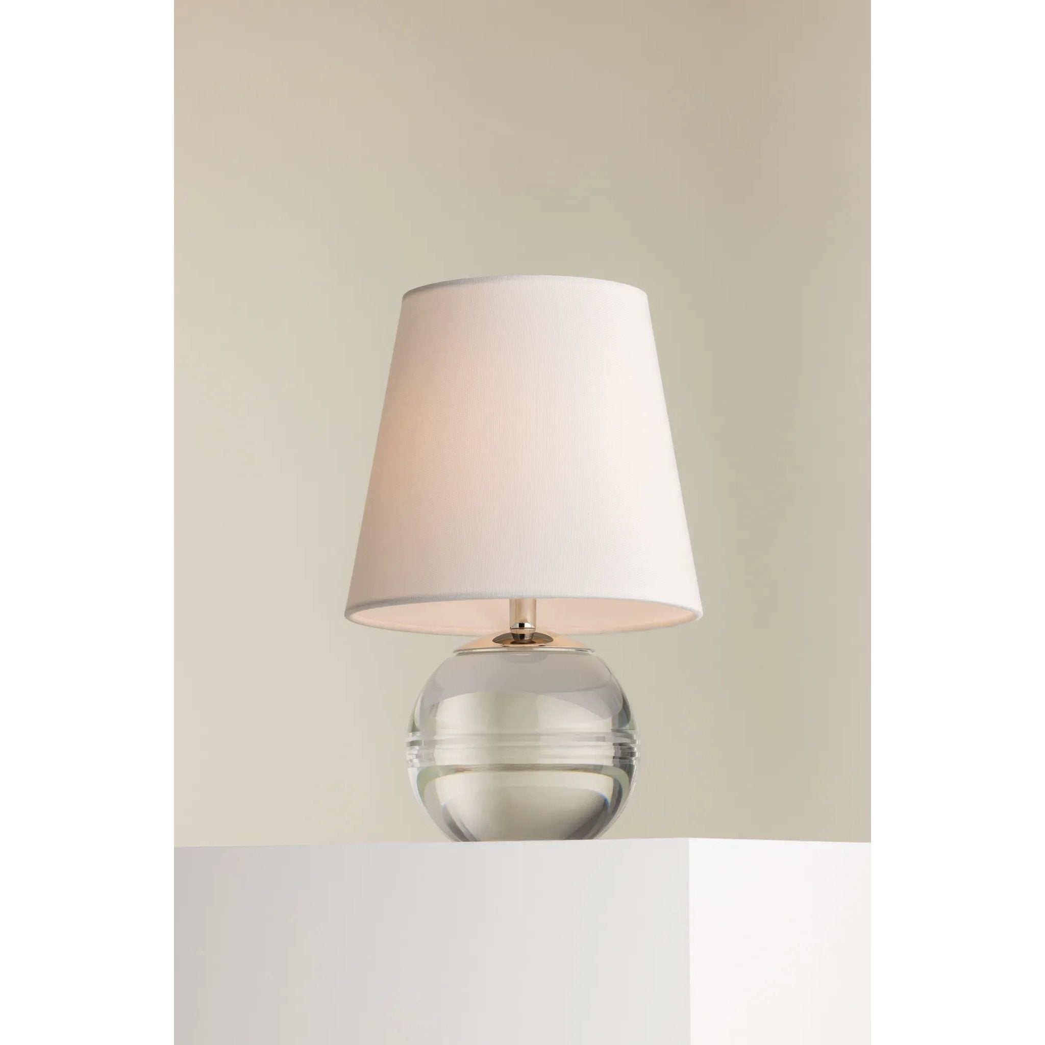 Ridged with ripple-like cuts, the crystal base of the Nicole table lamp makes for an eye-catching accent piece. Topped with a beautiful white linen shade, this pretty portable is rechargeable, adding convenience when styling. With classic Aged Brass-finished hardware, it’s the perfect addition to any bookshelf or small space. Amethyst Home provides interior design, new home construction design consulting, vintage area rugs, and lighting in the Tampa metro area.