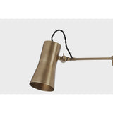 Tailored task lighting, this portable, functional swing arm sconce is also thoughtfully designed and beautiful. The sleek arm features a wooden handle on one end and an adjustable metal shade in Patina Brass or Bronze on the other. The twisted black cord detailing at the shade and backplate give Novel a nostalgic feel. Amethyst Home provides interior design, new home construction design consulting, vintage area rugs, and lighting in the Calabasas metro area.