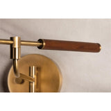 Tailored task lighting, this portable, functional swing arm sconce is also thoughtfully designed and beautiful. The sleek arm features a wooden handle on one end and an adjustable metal shade in Patina Brass or Bronze on the other. The twisted black cord detailing at the shade and backplate give Novel a nostalgic feel. Amethyst Home provides interior design, new home construction design consulting, vintage area rugs, and lighting in the Newport Beach metro area.