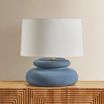 An exploration of voluminous forms and soft, endearing colors, the Pia family leans into the playful side of lighting. Stout proportions, generous curves, and stacked ceramic disc shapes lend an artisanal feel that is enhanced by the Butter Crackle and Chateau Crackle finishes. Amethyst Home provides interior design, new home construction design consulting, vintage area rugs, and lighting in the Portland metro area.