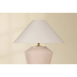 Inspired by raw beauty of the desert, this whitewashed terracotta table lamp is calm and refreshing. The textural body contrasts beautifully with the angular tapered white linen shade. An Aged Brass frame provides a surprising metallic finish. Part of THELIFESTYLEDCO® collection. Amethyst Home provides interior design, new home construction design consulting, vintage area rugs, and lighting in the Boston metro area.