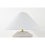 Inspired by raw beauty of the desert, this whitewashed terracotta table lamp is calm and refreshing. The textural body contrasts beautifully with the angular tapered white linen shade. An Aged Brass frame provides a surprising metallic finish. Part of THELIFESTYLEDCO® collection. Amethyst Home provides interior design, new home construction design consulting, vintage area rugs, and lighting in the Laguna Beach metro area.