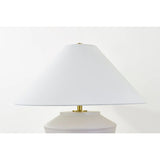 Inspired by raw beauty of the desert, this whitewashed terracotta table lamp is calm and refreshing. The textural body contrasts beautifully with the angular tapered white linen shade. An Aged Brass frame provides a surprising metallic finish. Part of THELIFESTYLEDCO® collection. Amethyst Home provides interior design, new home construction design consulting, vintage area rugs, and lighting in the Laguna Beach metro area.