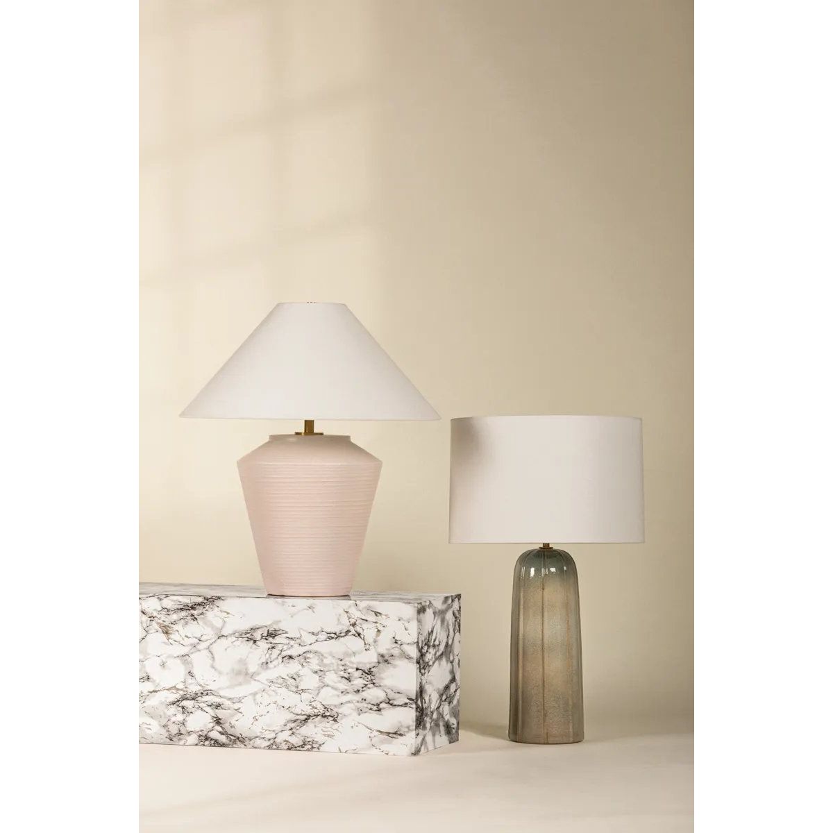 Inspired by raw beauty of the desert, this whitewashed terracotta table lamp is calm and refreshing. The textural body contrasts beautifully with the angular tapered white linen shade. An Aged Brass frame provides a surprising metallic finish. Part of THELIFESTYLEDCO® collection. Amethyst Home provides interior design, new home construction design consulting, vintage area rugs, and lighting in the Monterey metro area.